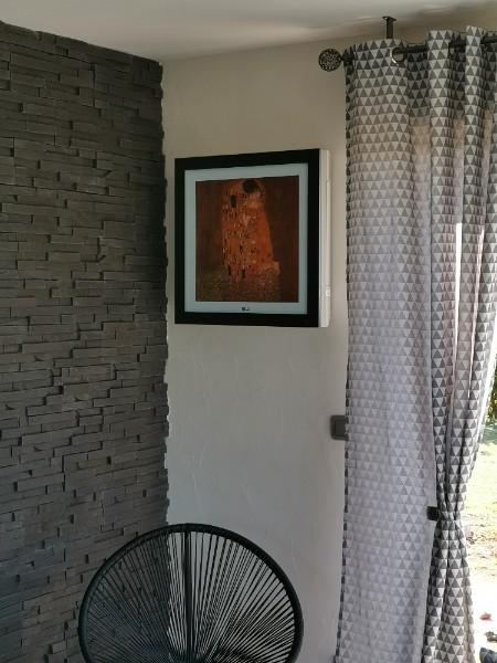 Installation d'une climatisation avec panel photo dans véranda et salon